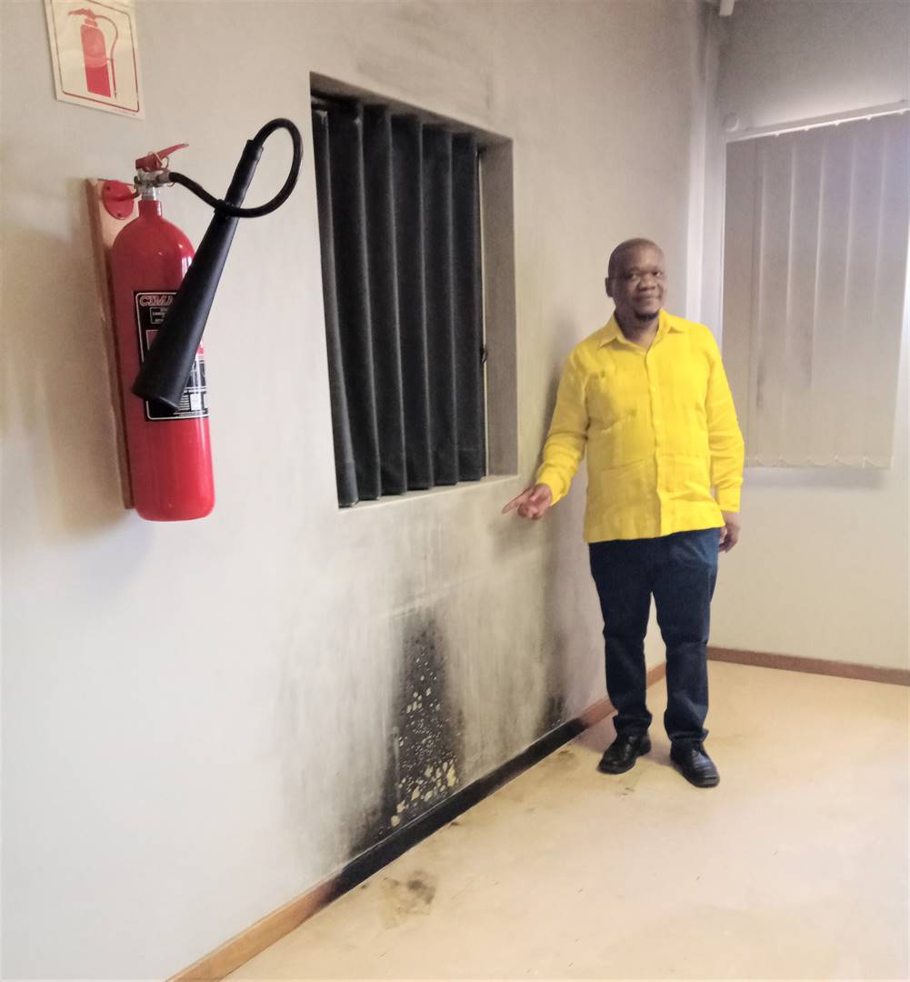 MEC for Education, Tate Makgoe, at the partly burnt section of the Gonyane Primary School’s administration block during an oversight visit last Wednesday.Photo: Teboho Setena