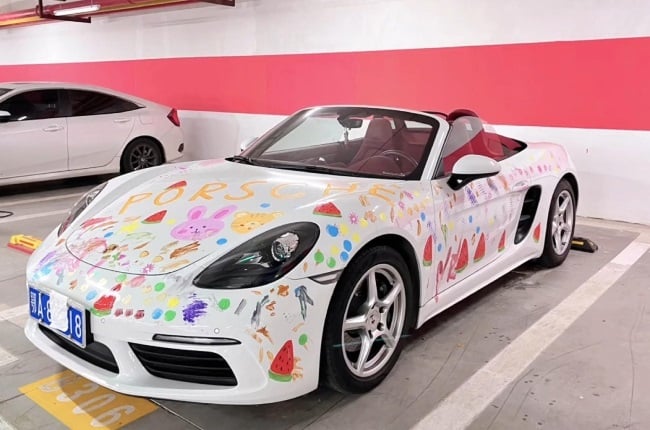 Mother lets daughter paint Porsche.