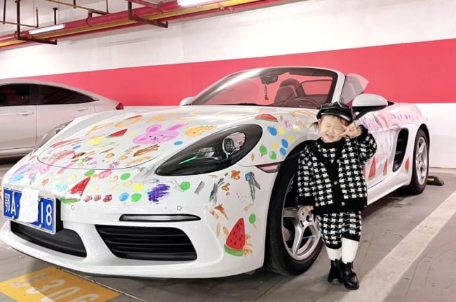 Two-year-old who painted her mother's Porsche.