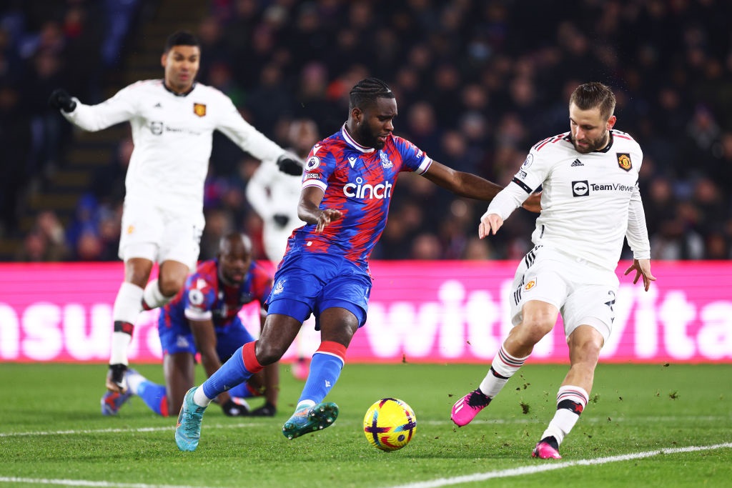 LONDON, ENGLAND - JANUARY 18: Odsonne Edouard of Crystal Palace is challenged by Luke Shaw of Manchester United during the Premier League match between Crystal Palace and Manchester United at Selhurst Park on January 18, 2023 in London, England. (Photo by Clive Rose/Getty Images)