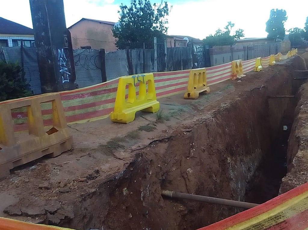 A trench that was dug by municipality workers in front of people's homes in Bekkersdal. Photos by Sammy Moretsi