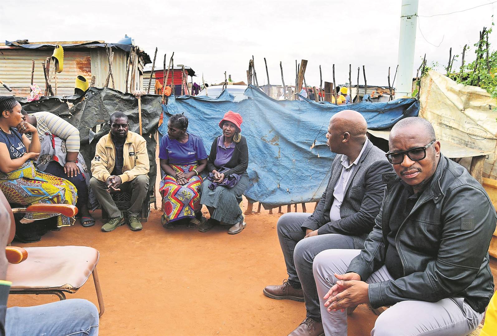 Education MEC Matome Chiloane (right) visited the family of Nsovo Ndlovu, a grade 11 pupil who died in a car crash last Monday.                                                                Photo by Lucky Morajane 