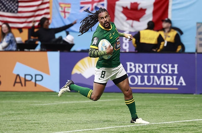 Selvyn Davids of South Africa scores a try in the World Rugby Sevens Series. (Photo by Jeff Vinnick/Getty Images)