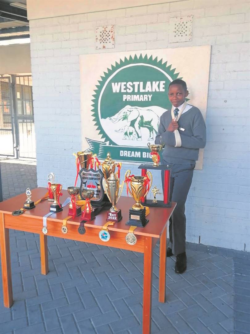 Budlelwane Nginingini from Khayelitsha with some of his trophies he received in karate.