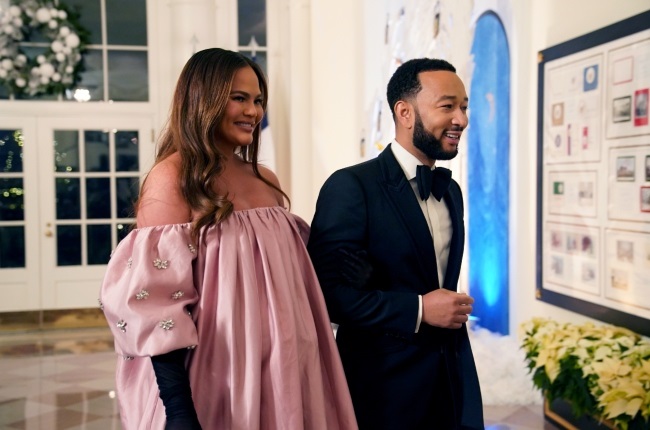 Former model Chrissy Teigen and her husband, singer John Legend, at a White House state dinner in December about a month before she gave birth to their fourth child, Esti. (PHOTO: Gallo Images/Getty Images) 