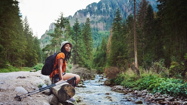 Shot of a young attractive woman hiking in nature