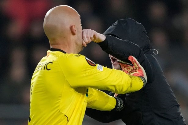 Sevilla's Marko Dmitrovic was attacked by a supposed PSV Eindhoven fan during their UEFA Europa League encounter on Thursday.