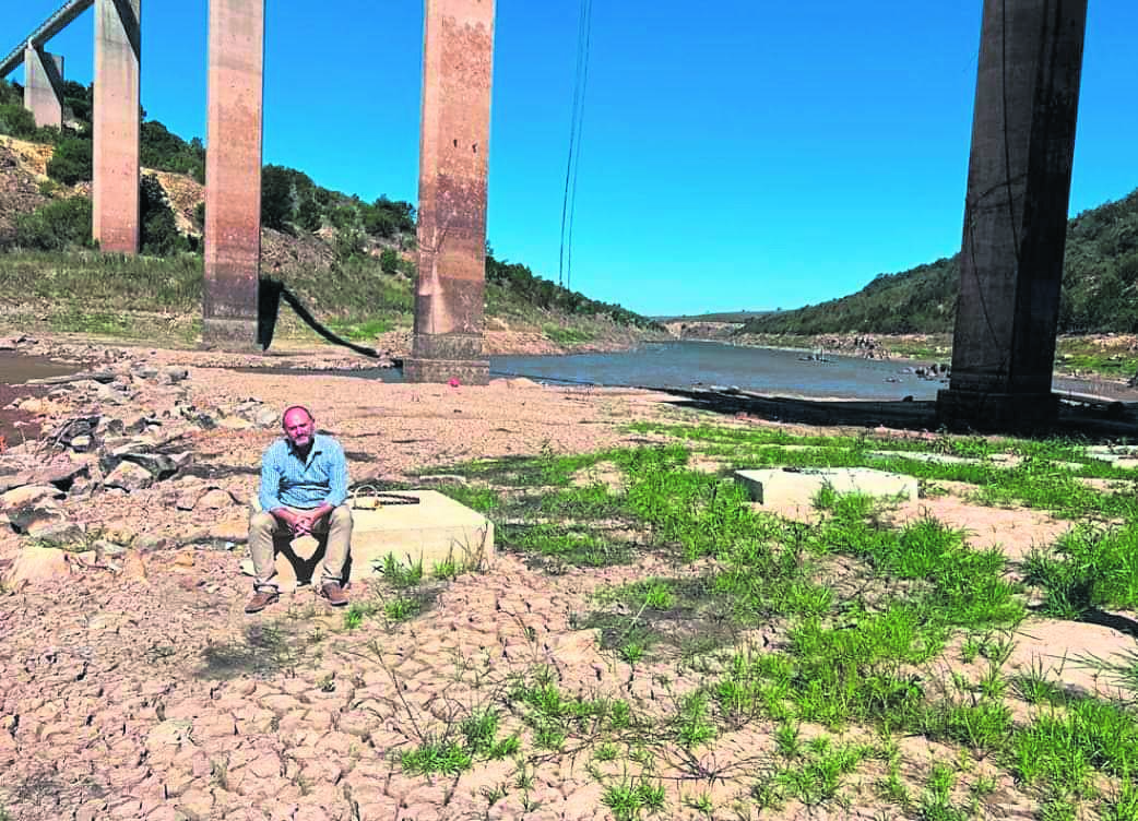 Executive Mayor Retief Odendaal sitting in the centre of an almost empty Impofu Dam, the biggest supply dam to Nelson Mandela Bay. Data providing evidence that tens of thousands of households are still consuming more than 150 liters per person per day and are oblivious to the fact that parts of NMB can run out of water amidst the most intense drought on record. 