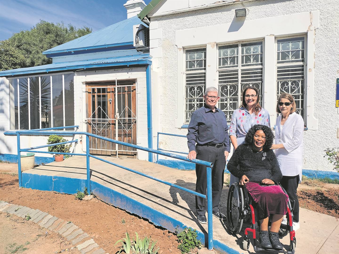 The building on the premises of the Association for People with Disabilities (APD) that will soon house a Centlec call centre. In front of the future centre are from the left, front: Nthabiseng Molongoana (provincial director of the APD); back: Gary Long (general manager for Property House Group – PHG), Sonette Boshoff (chairperson of the PHG board) and Jackie Malan (social worker and project manager at the APD).Photo: Lientjie Mentz