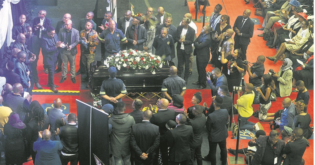  Friends and family surround HHP’s coffin, reciting eulogies and singing songs. Picture: Rosetta Msimango