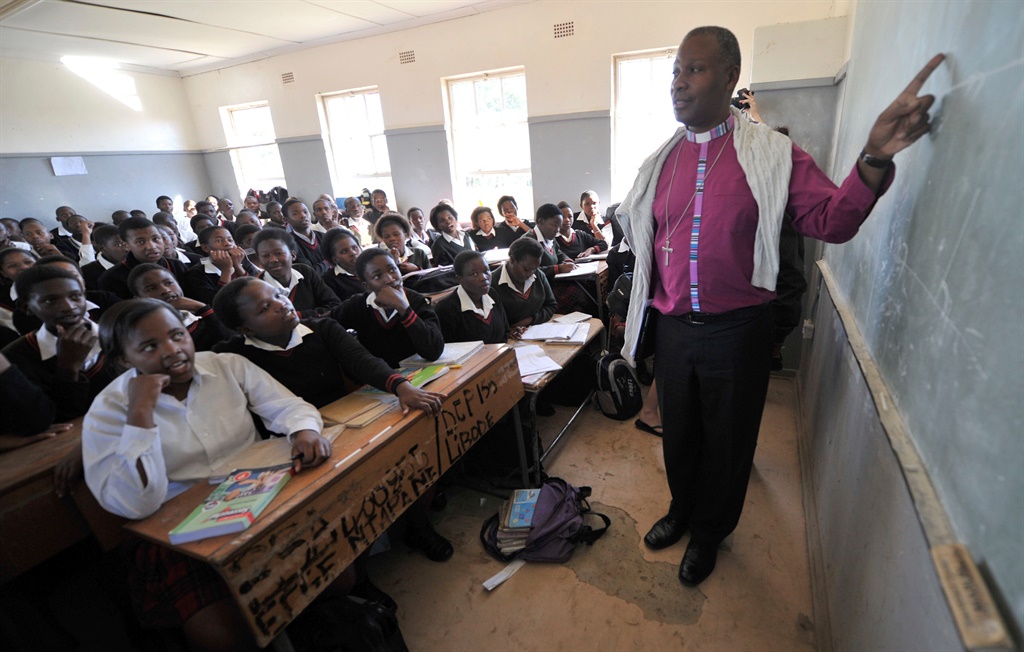 Anglican Archbishop Thabo Makgoba interacts with pupils in an overcrowded classroom at Ntapane Senior Secondary School in Libode. Picture: Khaya Ngwenya