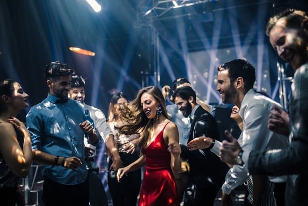 Shot of a young woman dancing in the nightclub