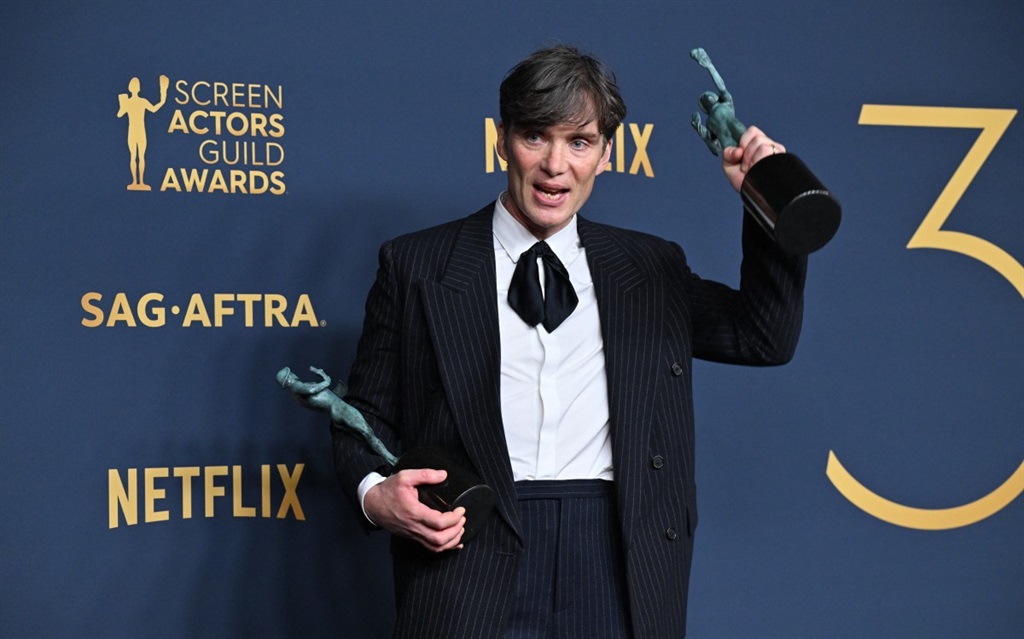 Irish actor Cillian Murphy poses in the press room with the awards for Outstanding Performance by a Male Actor in a Leading Role in a Motion Picture and Outstanding Performance by a Cast in a Motion Picture for "Oppenheimer" during the 30th Annual Screen Actors Guild awards at the Shrine Auditorium in Los Angeles, February 24, 2024.