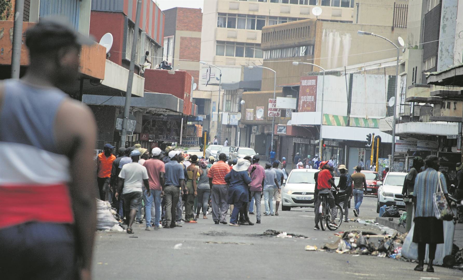 Taxi drivers and concerned residents walk in the Springs CBD looking for drugs.     Photo by Ntebatse Masipa