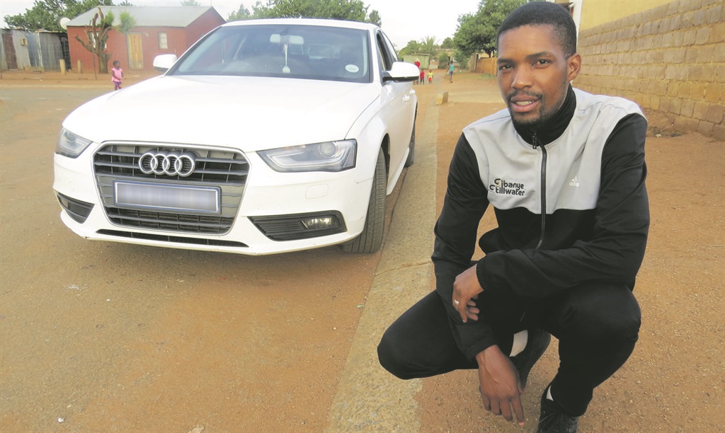 Buti Mpetsheni with his Audi A4 which fits his family of four.      Photo by Sammy Moretsi