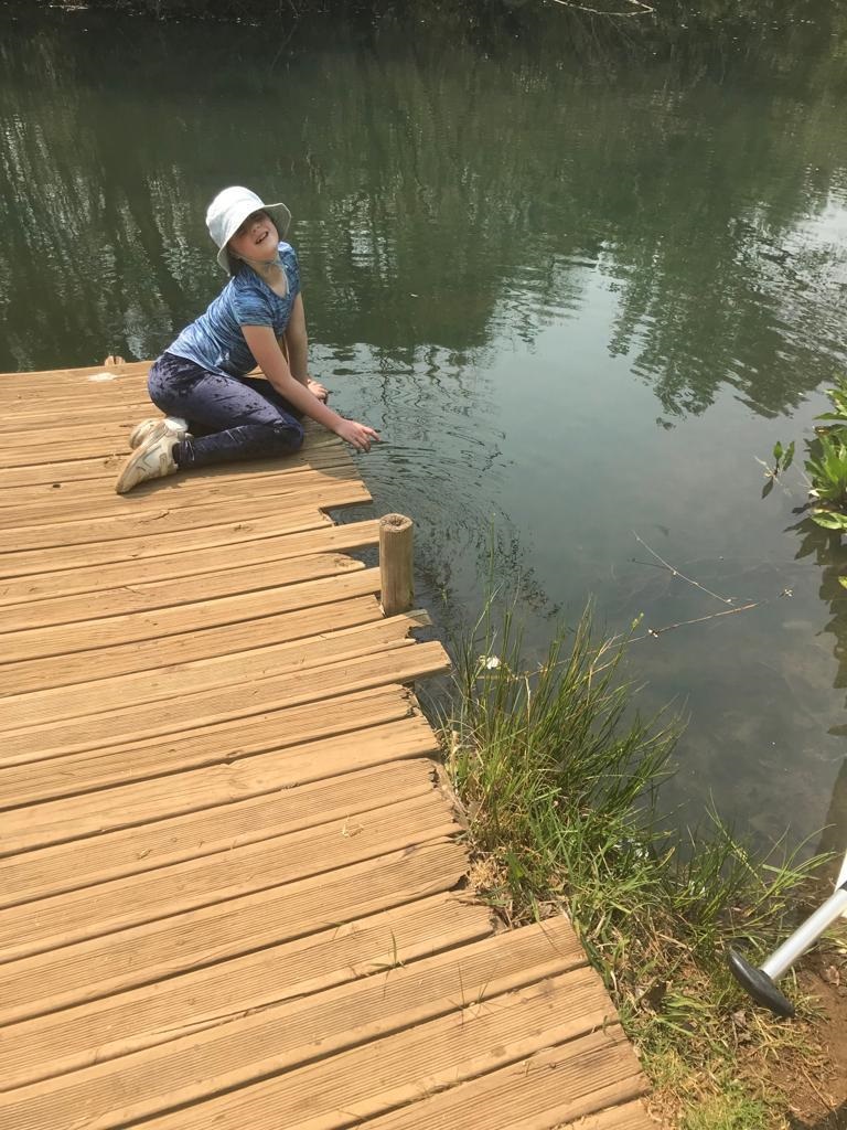 The writer’s daughter, Frances, looking for tadpoles in the sparklingly clean river that Valley Lodge and Spa overlooks PICTURE: GAYLE EDMUNDS