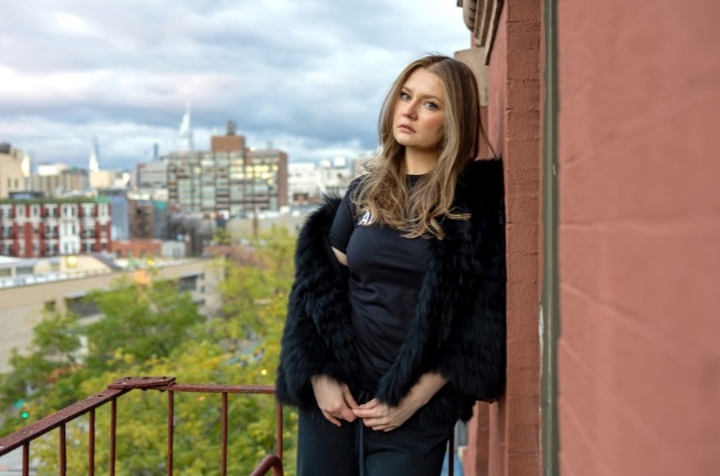 Anna Sorokin on the balcony of her Manhattan home, where her new reality TV show will be filmed. (PHOTO: Getty Images)