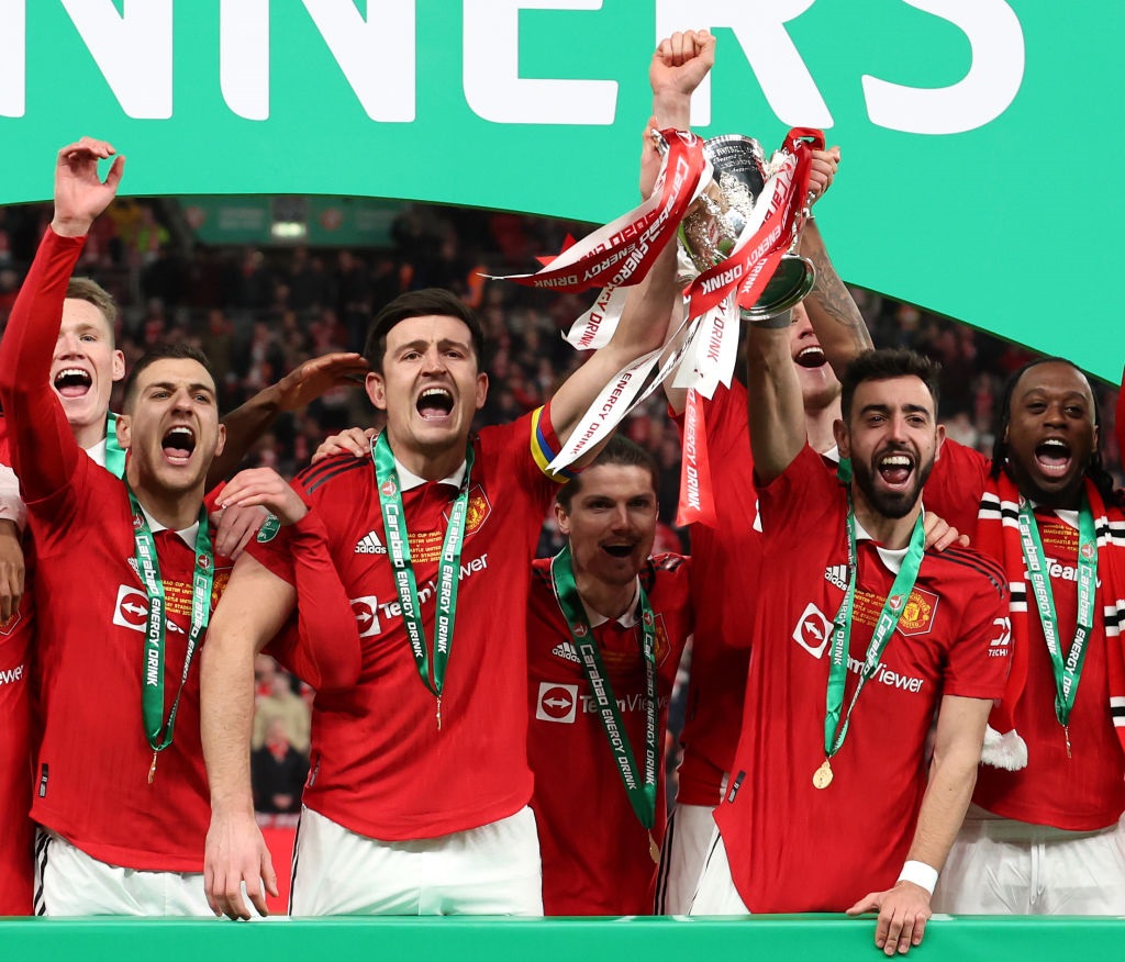 LONDON, ENGLAND - FEBRUARY 26: Bruno Fernandes and Harry Maguire of Manchester United lift the Carabao Cup trophy following victory in the Carabao Cup Final match between Manchester United and Newcastle United at Wembley Stadium on February 26, 2023 in London, England. (Photo by Julian Finney/Getty Images)