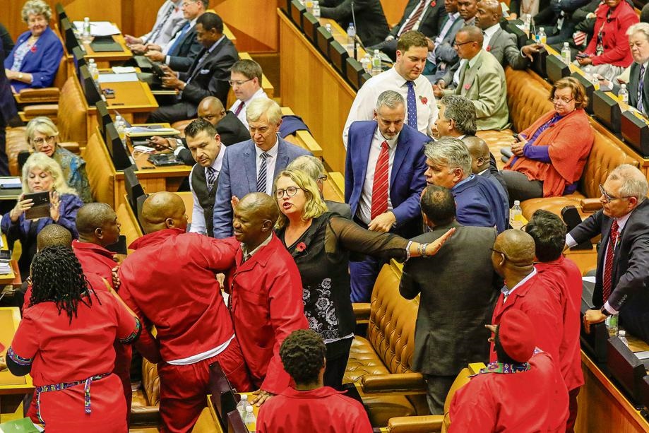 Members of the EFF and DA fight in the National Assembly of Parliament.