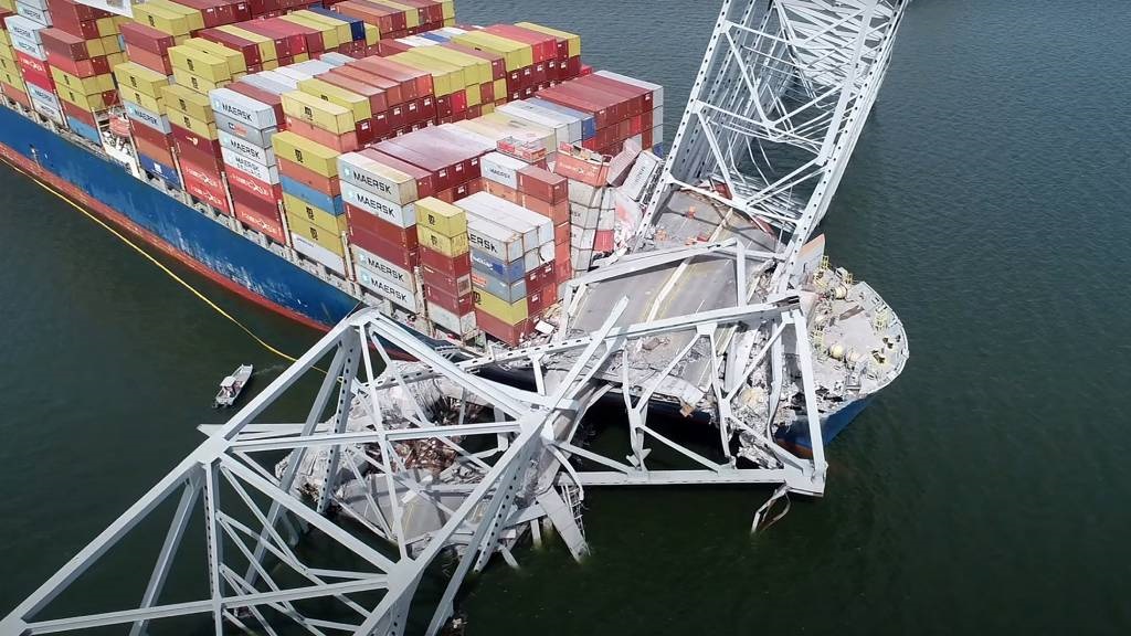 This handout screengrab courtesy of the National Transportation Safety Board taken on 26 March 2024 shows part of the steel frame of the Francis Scott Key Bridge on top of the container ship Dali after the bridge collapsed in Baltimore, Maryland. (National Transportation Safety Board/YouTube/AFP)