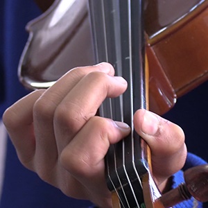 A student practices the violin at the Hillbrow Music Centre. (Screengrab)