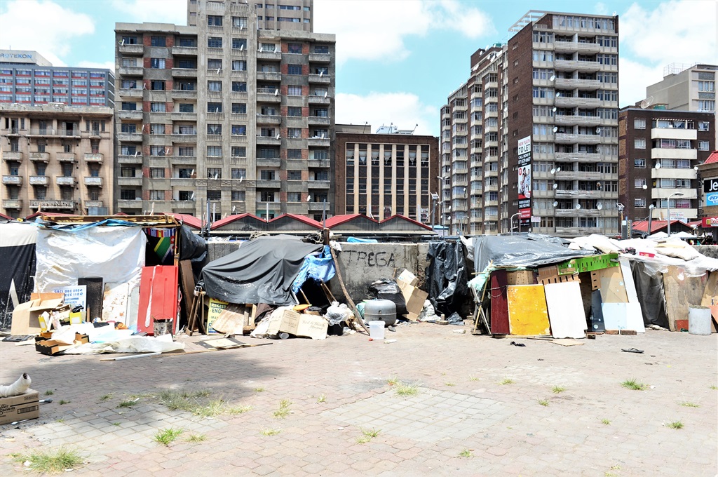 CaptionJoburg residents and visitors to the Johannesburg Art Gallery are intimidated by overpopulated hawkers and squatters. Photo by Morapedi Mashashe
