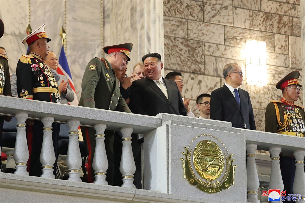  North Korea's leader Kim Jong Un (C) attending a 