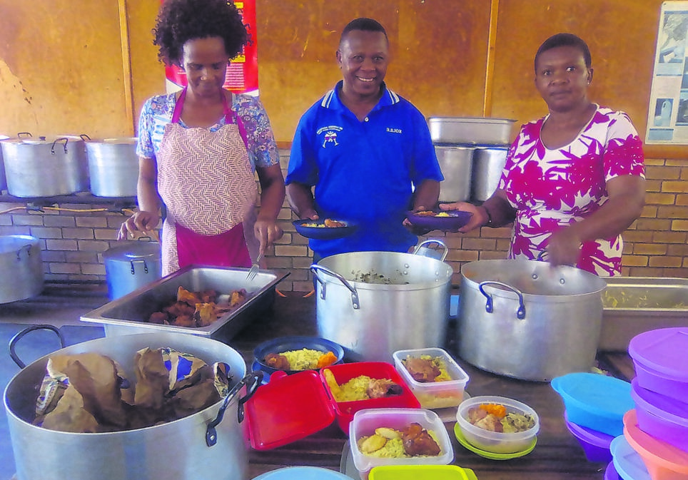 From left: Noluvuyo Kamla, Xolile Bonakele and Zoliswa Mbambo prepare food for pupils camping at the local high school in Motherwell.             Photo by Godfrey Sigwela