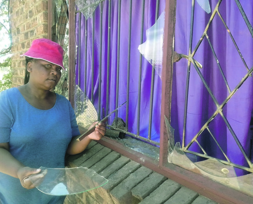 Ntswaki Shokwe’s windows were broken during the Maroma gang’s recruitment drive. Photo by Modiri Michaels