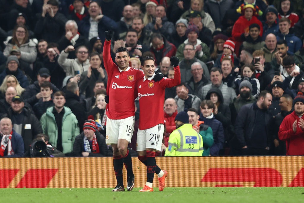 MANCHESTER, ENGLAND - JANUARY 28: Casemiro of Manchester United celebrates with teammate Antony after scoring the teams first goal during the Emirates FA Cup Fourth Round match between Manchester United and Reading at Old Trafford on January 28, 2023 in Manchester, England. (Photo by Naomi Baker/Getty Images)