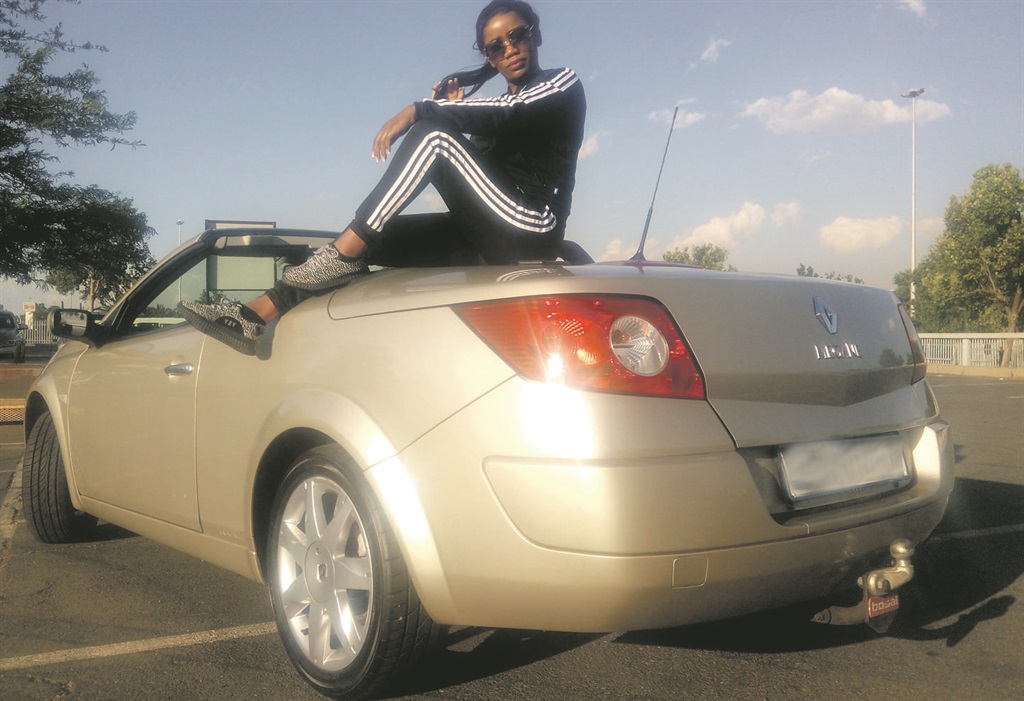 Mpho and her sexy coupé bring the fire to the street.  Photo by     Kopano Monaheng
