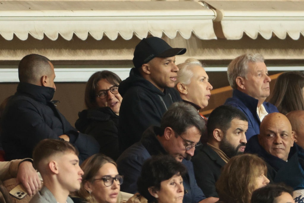 MONACO, MONACO - MARCH 1: Kylian Mbappe of PSG looks on from the tribune with his mother Fayza Lamari after being substituted at half time during the Ligue 1 Uber Eats match between AS Monaco (ASM) and Paris Saint-Germain (PSG) at Stade Louis II on March 1, 2024 in Monaco, Monaco. (Photo by Jean Catuffe/Getty Images)