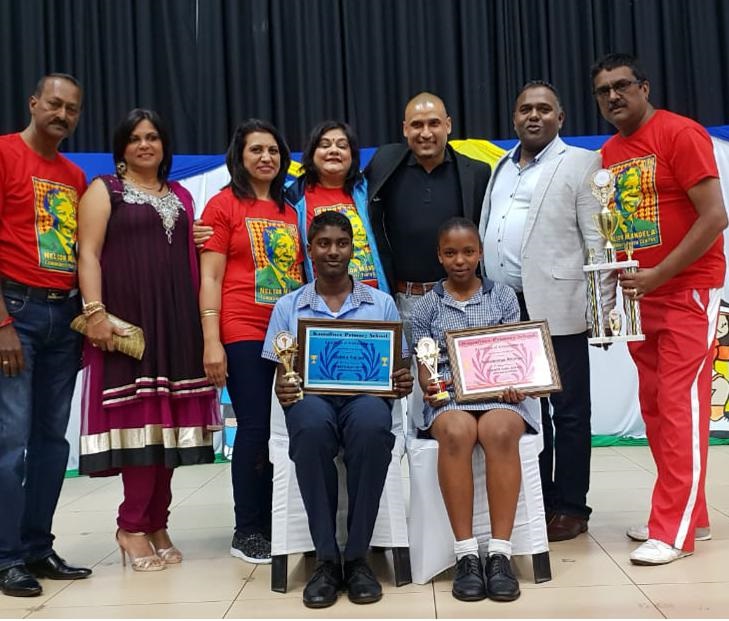 At the event were (back, from left) Jagatheesan Naidoo (Principal), Serene Nair (Acting Chairperson: Isipingo Schools Sports Council), Dayanthi Devi Preamduth (Convenor), Shanilia Devi Singh (Deputy Principal), Delron Buckley (Guest of Honour), Donald Naidoo (Chairperson: SGB), and Kamalpersad Singh (Director of Sports) with (seated from left) Delron Rajjiah (Sports Boy 2018) and Nokubonga Shange (Sports Girl 2018).PHOTO: supplied