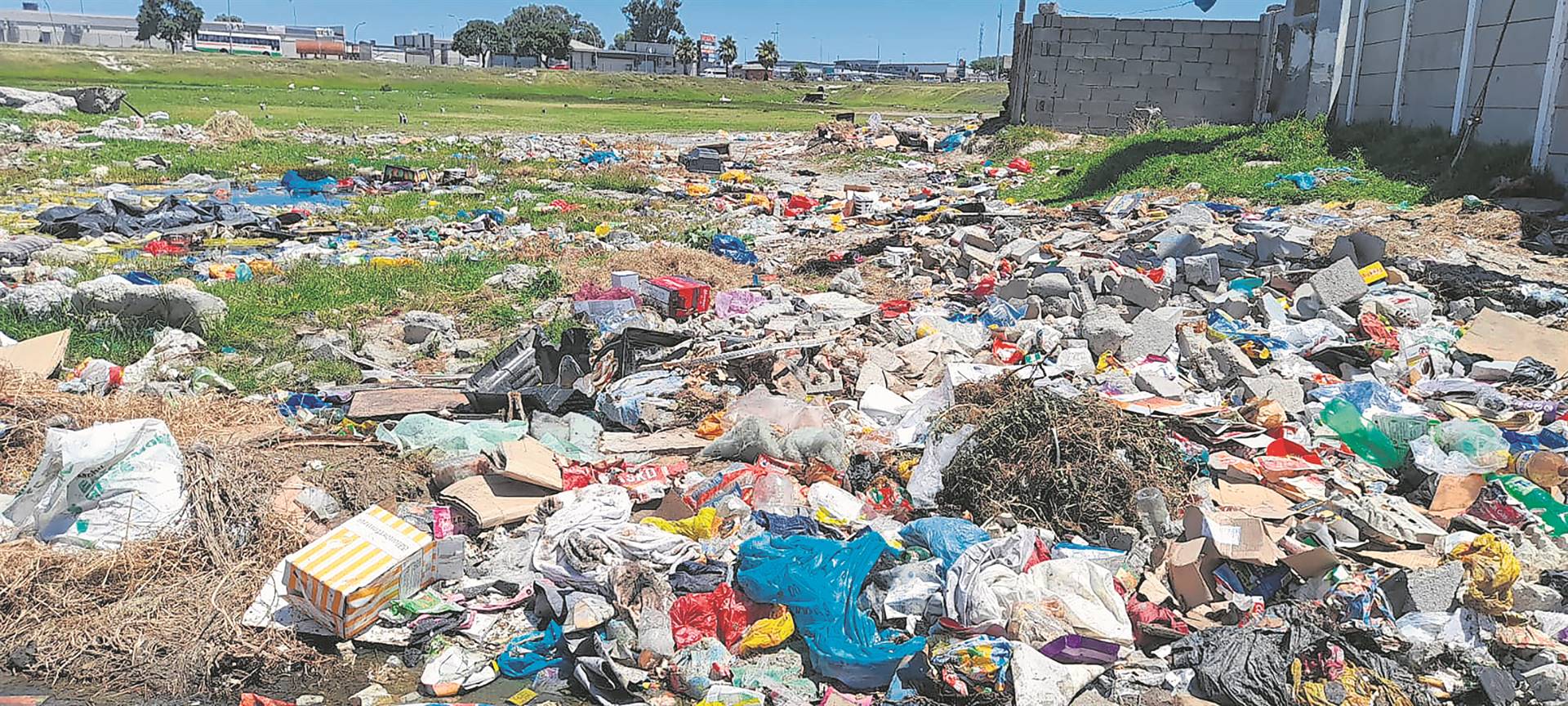 Residents of Crossroads have had enough of people and vehicles dumping rubbish at this open field near their homes.      Photo by Lulekwa Mbadamane