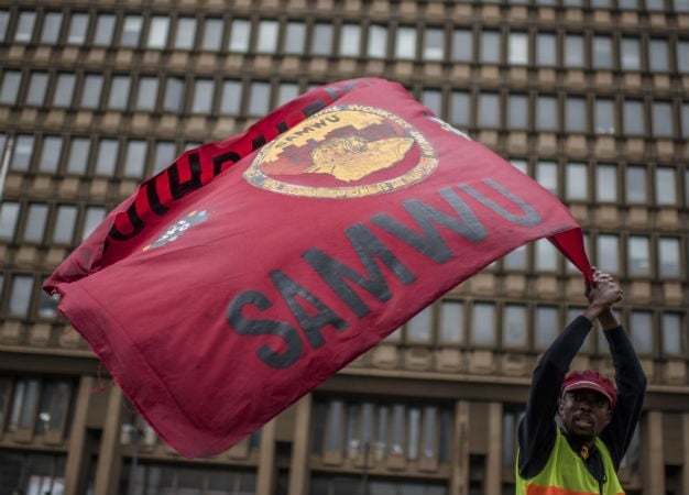 A man flies the Samwu flag during a protest in Johannesburg. Picture: Cornel Van Heerden, Gallo Images