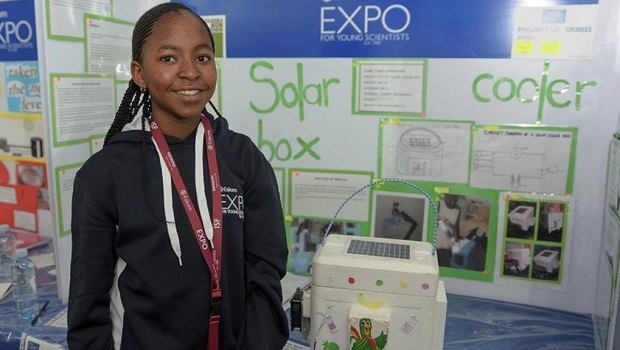 Tumelo poses proudly next to her invention