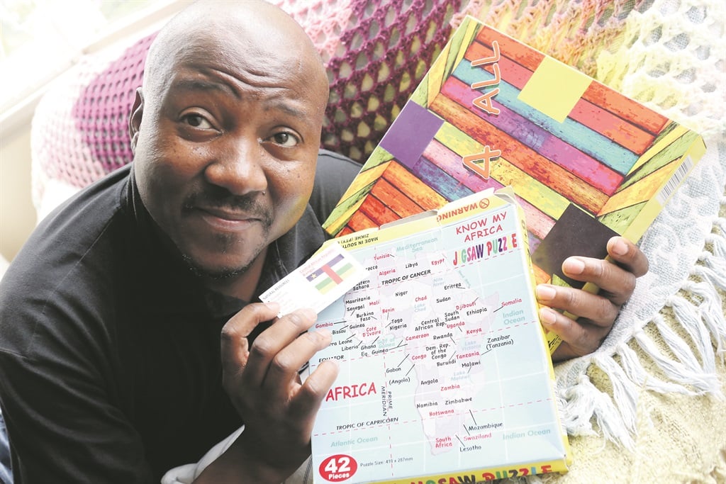 Entrepreneur and inventor Khangelani Gama with his board games, Know My Africa and Game 4 All