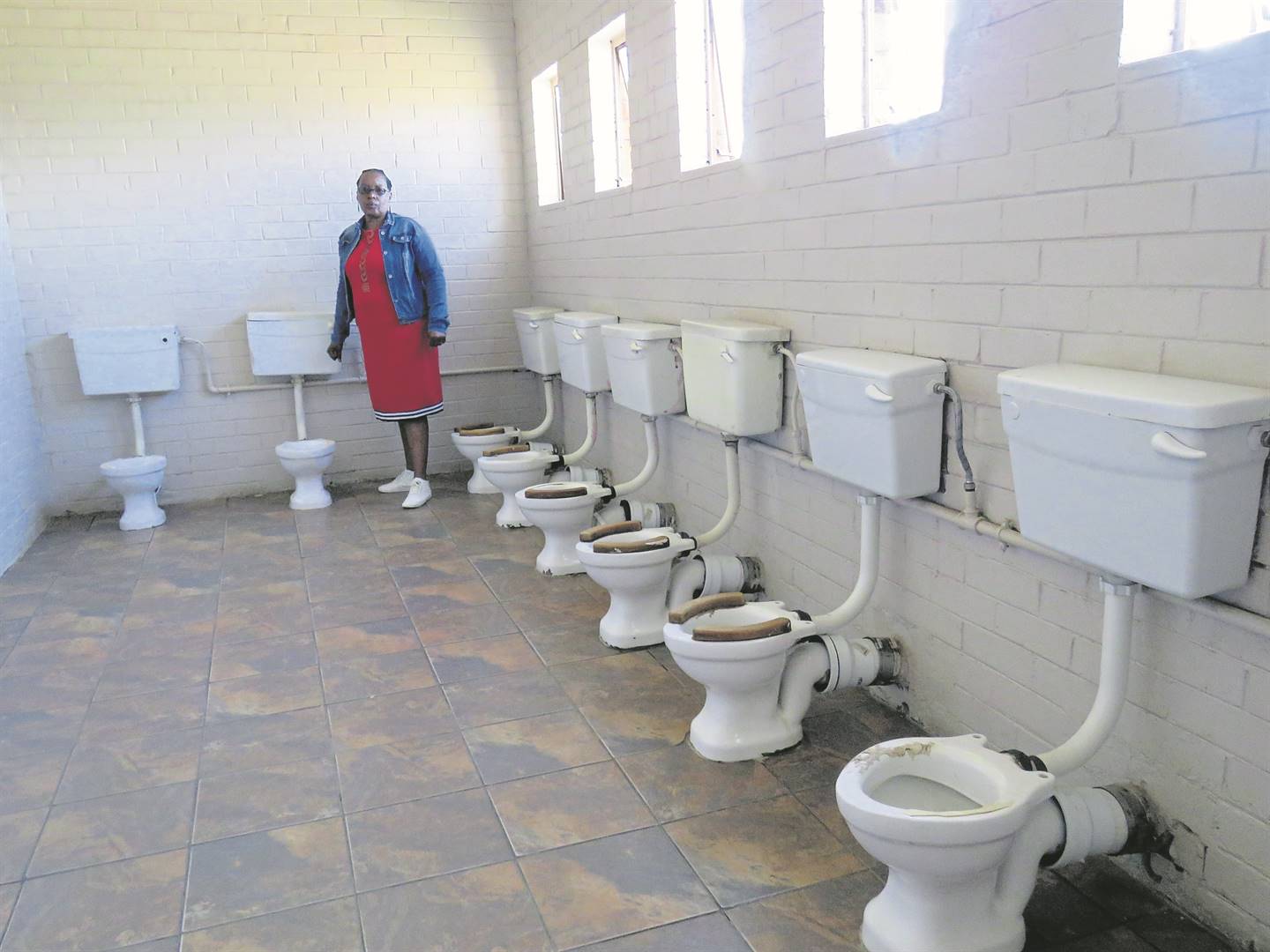 Nomsa Mokoena shows the SunTeam the state of the toilets at Mabel Zozo Creche.   Photo by Ntebatse Masipa