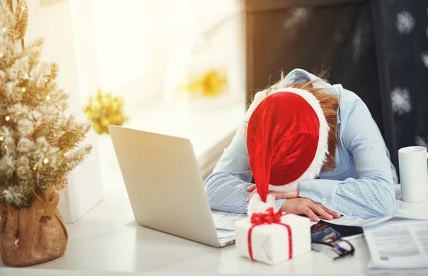 woman stressed at her desk over festive season 