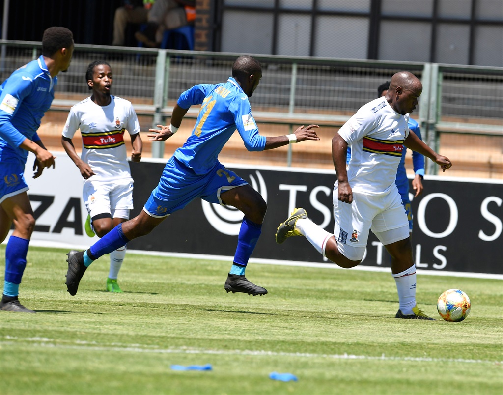  Collins Mbesuma of Pretoria University FC  is challenge by Happy Mashau of Royal Eagles players during the GladAfrica Championship match between Pretoria University FC and Royal Eagles at ABSA Tuks Stadium on December 14, 2019 in Pretoria, South Africa