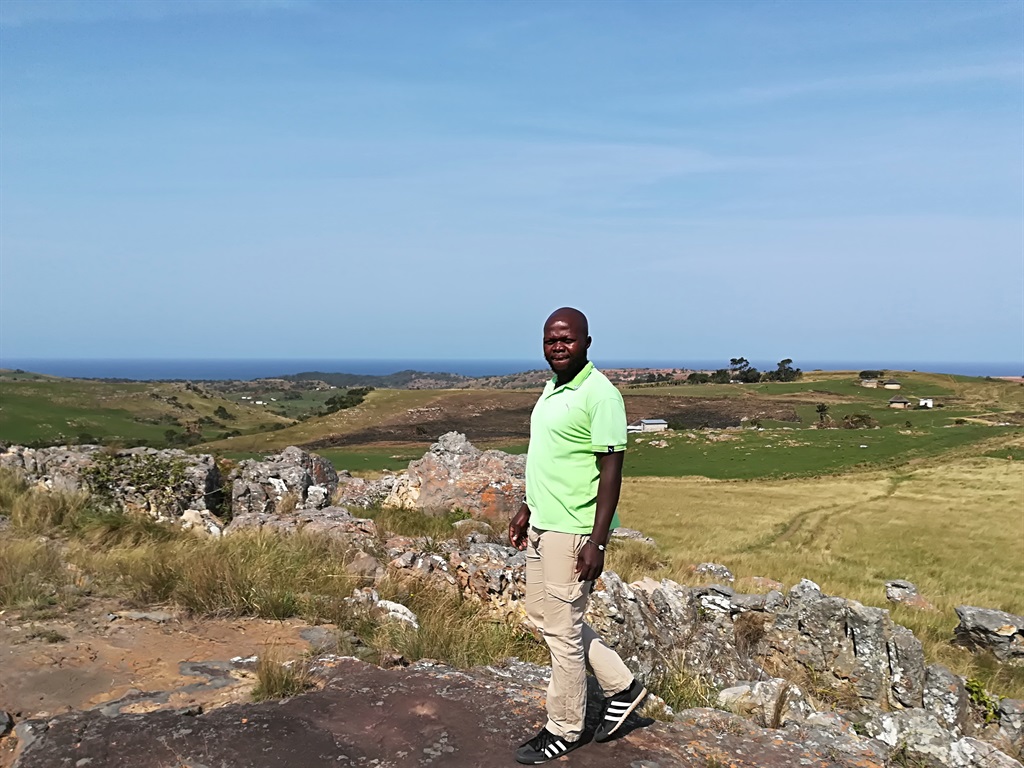 Sibusiso Mqadi, an anti-Xolobeni mining activist and chairperson of the Amadiba Crisis Committee which opposes mine in the area. Behind him is the area which had been earmarked for the controversial mining project. Picture: Lubabalo Ngcukana/City Press