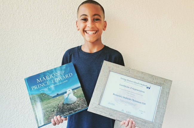 Romario Valentine received a special certificate for raising funds to eradicate mice on Marion Island. (PHOTO: Supplied)