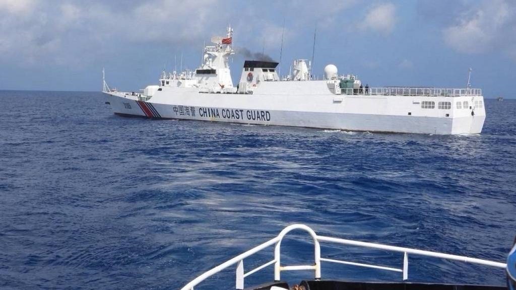 This handout photo from the Philippine Coast Guard shows a China Coast Guard vessel sailing near the BRP Datu Sanday during their mission to bring supplies to fishermen near the China-controlled Scarborough Shoal in the disputed South China Sea. (Handout/Philippine Coast Guard/AFP)