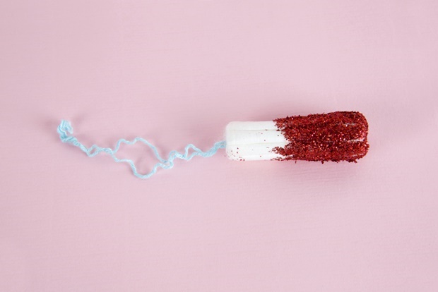 A hygienic tampon with red glitters instead of blo
