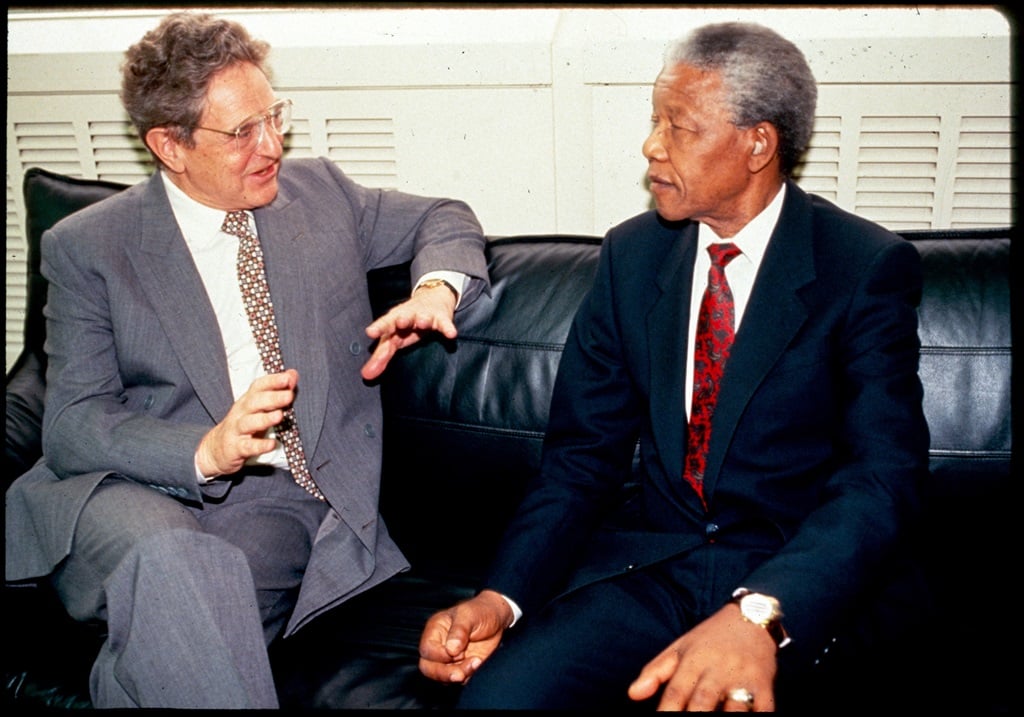 Nelson Mandela (right) listens to George Soros in Johannesburg, 1994. Picture: Greg Marinovich 