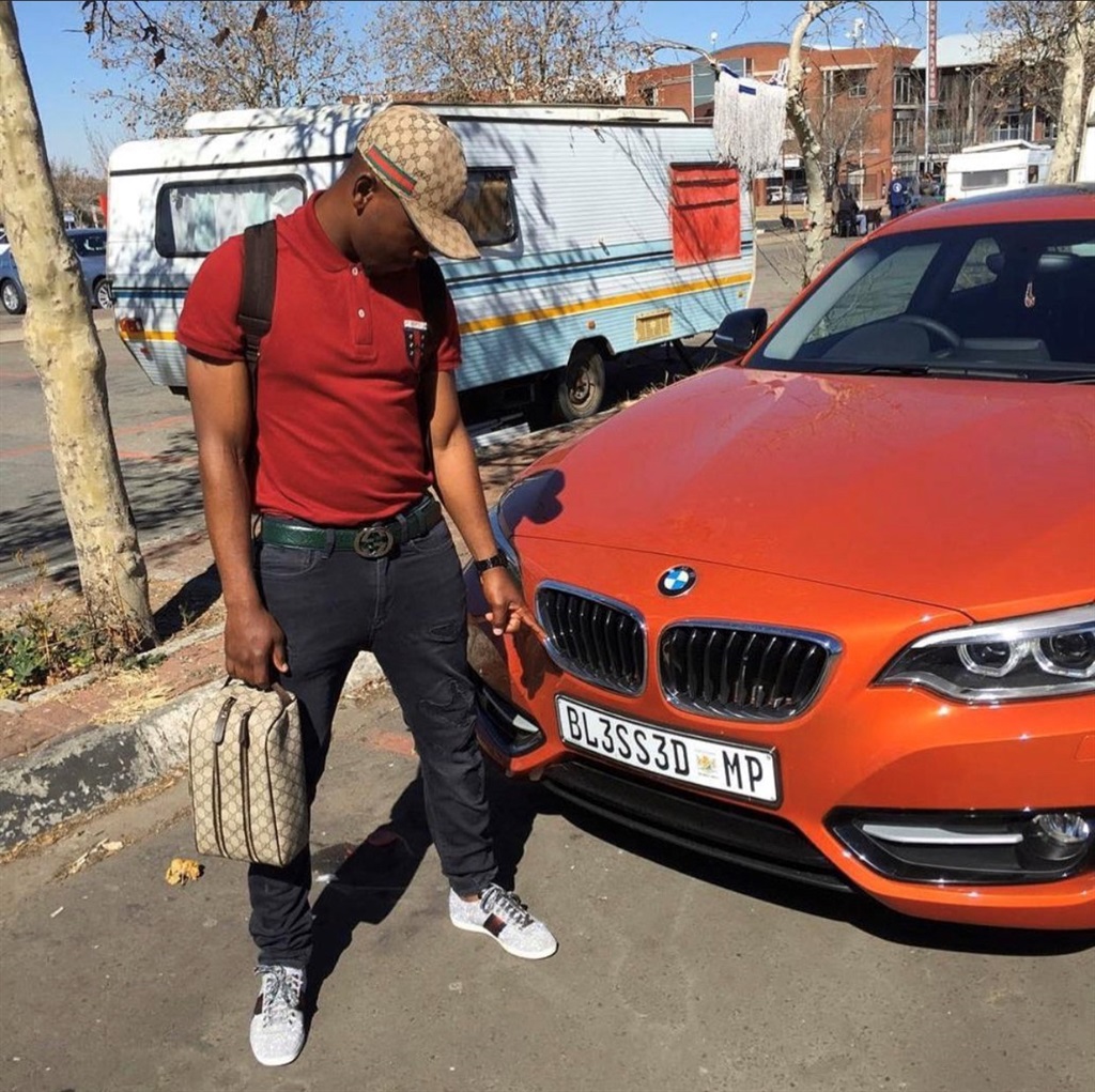 A Gucci-ridden May Mahlangu alongside his BMW 2 series.