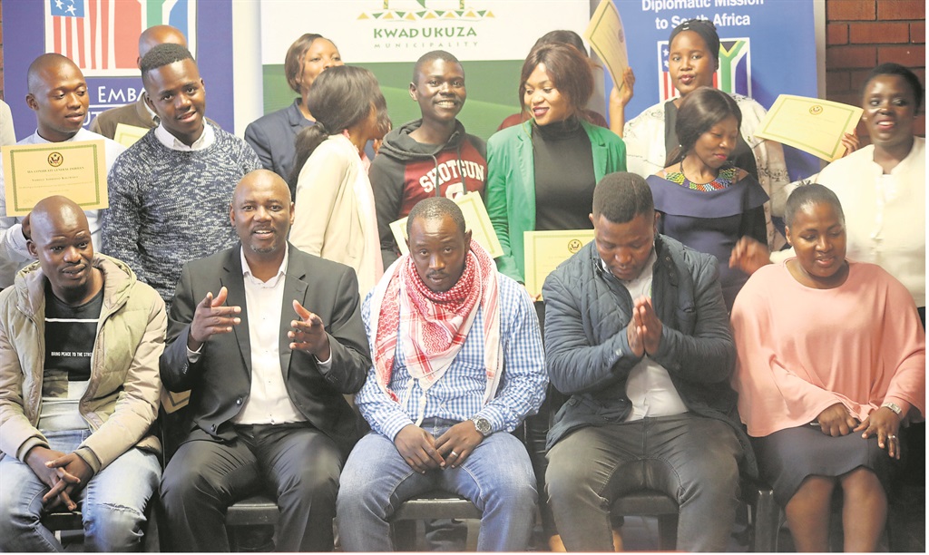 Front from left: Officials Nicholas Nzuza, Thula Ngcobo, John Phahla, Sikhumbuzo Mzimela and Nelisiwe Zulu with the 11 young people who received job readiness certificates last week.