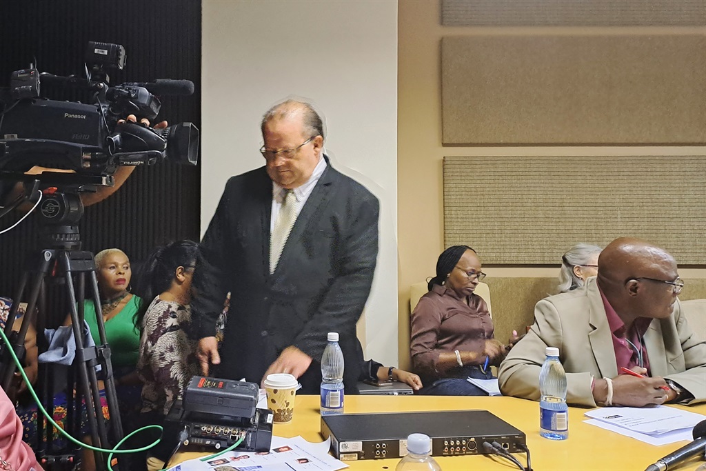SA Tourism interim CFO Johan van der Walt enters the parliamentary committee room on Tuesday after initially waiting outside.