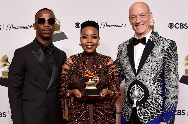 Zakes Bantwin, Nomcebo Zikode, and Wouter Kellerman pose in the press room during the 65th GRAMMY Awards at Crypto.com Arena. 