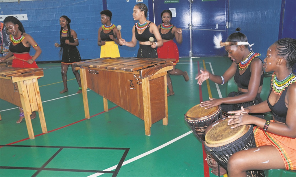 The Gugulethu Youth Group perform for residents at Gugulethu Sports Complex.  Photo by Lulekwa Mbadamane